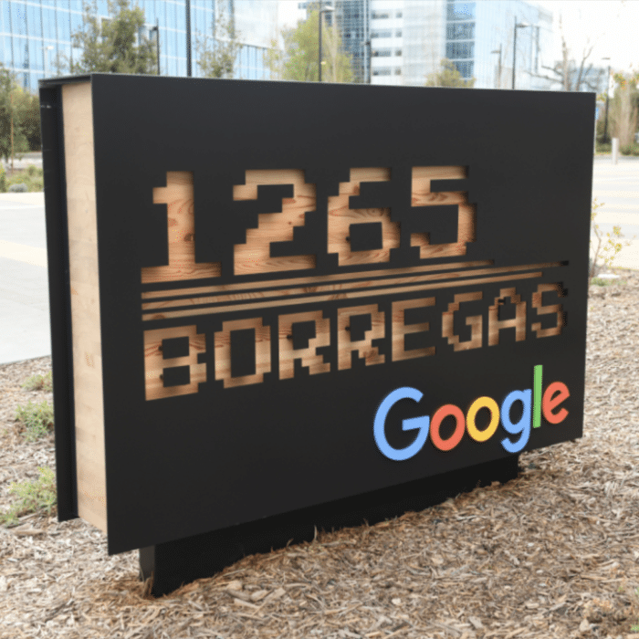 Google’s custom-routed address monument sign juxtaposes the sleekness of the digital world with the timeless allure of timber craftsmanship.